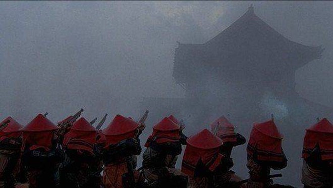 Still from Ran, with soldiers firing guns in medieval Japan